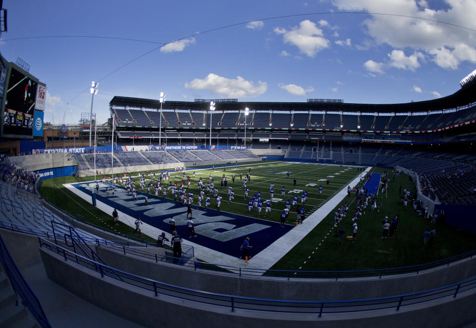 Georgia State football players practice at Georgia State Stadium, Thursday, Aug. 17, 2017, in Atlanta. Georgia State recently finished converting former home of the Atlanta Braves and the site of the 1996 Summer Olympic Games to a football stadium. (AP Photo/John Bazemore)