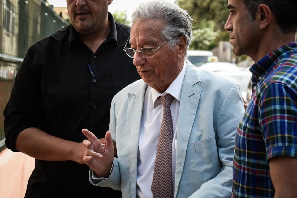 Spanish Civil Guard plainclothes policemen escort Spanish Football Federation (RFEF) vice president Juan Padron (C) outside the Football Federation building: Desiree Martin/AFP/Getty Images