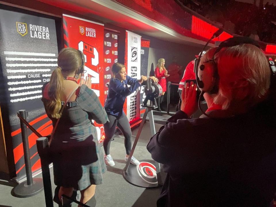 Raleigh’s Mary Derrenbacher sounds the warning siren before the Carolina Hurricanes game against the Calgary Flames on Sunday, March 10, 2024. Derrenbacher, 15, was the youngest player on the gold-medal-winning U.S. team at the World Women’s Under-18 Championships in Switzerland in January.