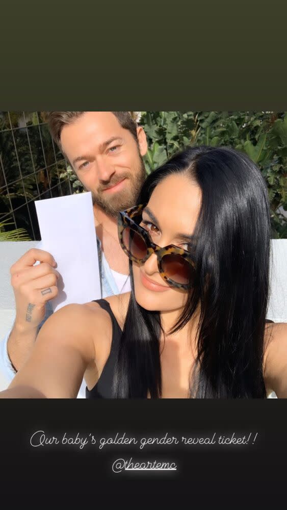 Nikki Bella touches her growing bump as she puts on loved-up display with  fiance Artem Chigvintsev