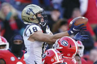 Georgia defensive back Lovasea Carroll (12) breaks up a pass intended for Charleston Southern wide receiver Cayden Jordan (18) in the second half of an NCAA college football game Saturday, Nov. 20, 2021, in Athens, Ga. (AP Photo/John Bazemore)