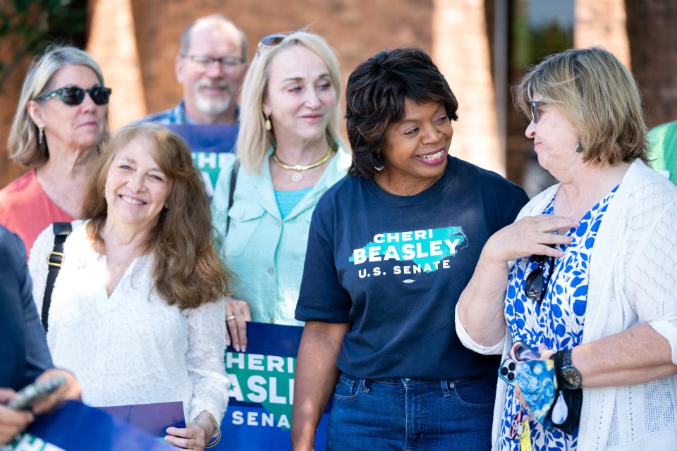 North Carolina Democratic Senate candidate Cheri Beasley, second from right, visits with voters outside a polling location on May 17 in Troy, N.C. North Carolina is one of several states holding midterm primary elections.