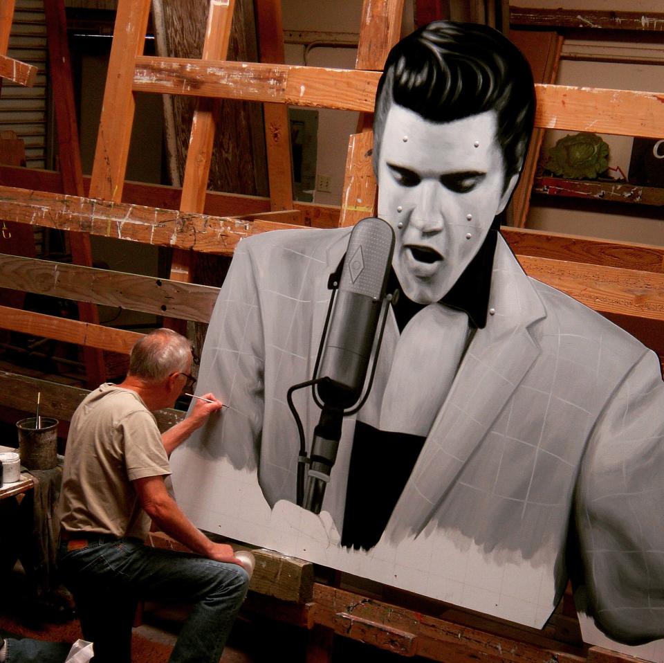 In his Salinas, California, studio, John Cerney works on the Elvis "cut-out" that now can be seen on Summer Avenue near East Parkway.