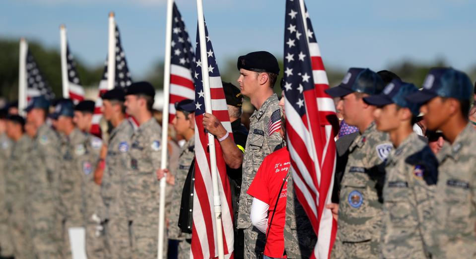 Civil Air Patrol members line the path for veterans returning from a Yellow Ribbon Honor Flight on July 29, 2022, at EAA AirVenture Oshkosh 2022, in Oshkosh, Wis.