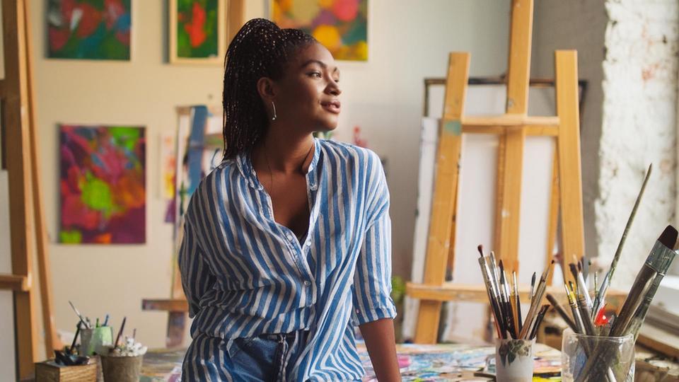 AI generated image of woman standing in art studio