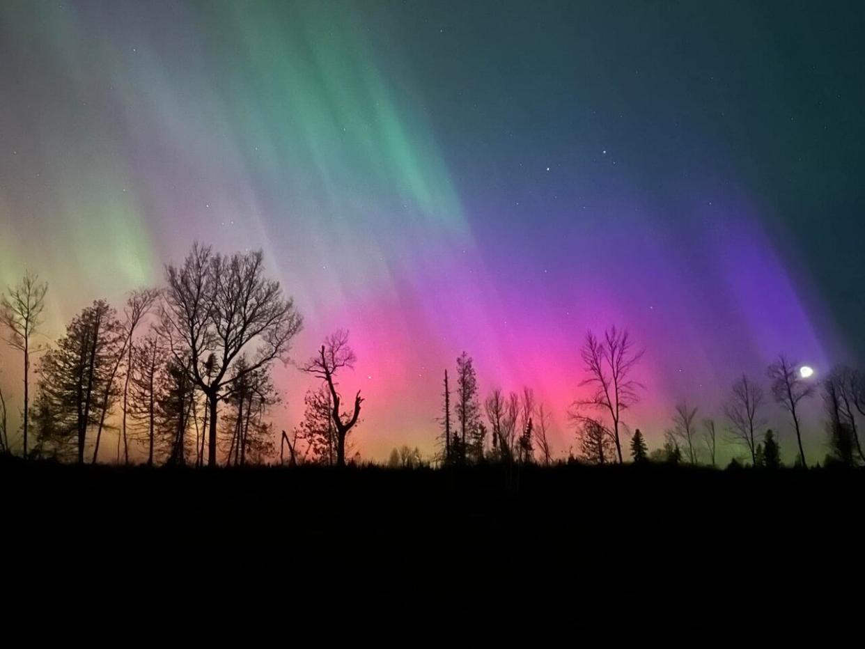 The northern lights are shown just after 11 p.m. on Friday in Warwick Settlement, west of Miramichi.  (Cindel A. Thibodeau - image credit)