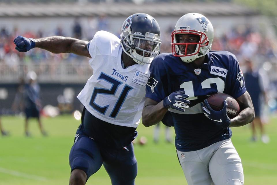 Titans cornerback Malcolm Butler, left, attempts to chase down Patriots receiver Phillip Dorsett during a joint practice between the teams in August 2019.