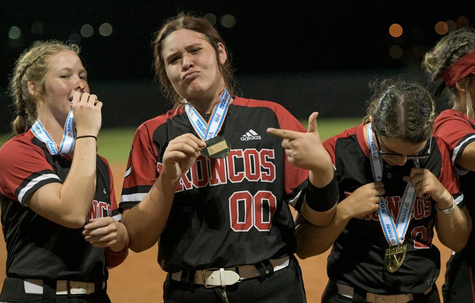Middleburg’s Kerra Clarida (00) poses with the state championship medal after the Broncos defeated Clermont South Lake for the Class 5A state championship in May.