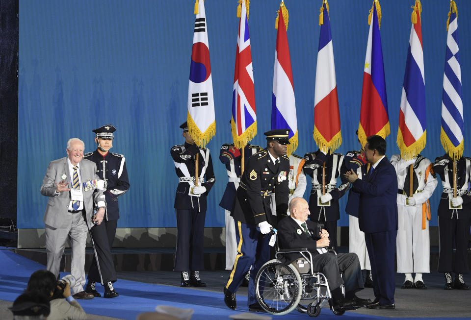 South Korean President Yoon Suk Yeol, right, greets Korean War veterans during the ceremony of the 70th Anniversary of the Korean War armistice agreement on Thursday, July 27, 2023, in Busan, South Korea. (Kim Min-Hee/Pool Photo via AP)