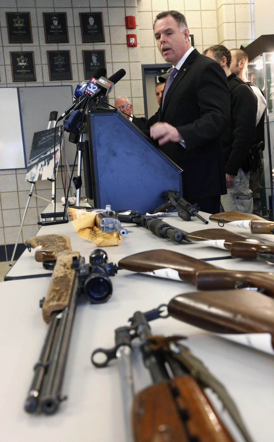 FILE - In this Feb. 26, 2013 file photo, Chicago Police Superintendent Garry McCarthy stands near guns confiscated in Chicago and talks about the department's efforts to curb gun violence during a news conference in Chicago. On Monday, Jan. 6, 2014, a federal judge in Chicago potentially opened a new market to gun dealers after ruling as unconstitutional Chicago ordinances that aim to reduce gun violence by banning their sale within the city's limits. (AP Photo/Charles Rex Arbogast, File)