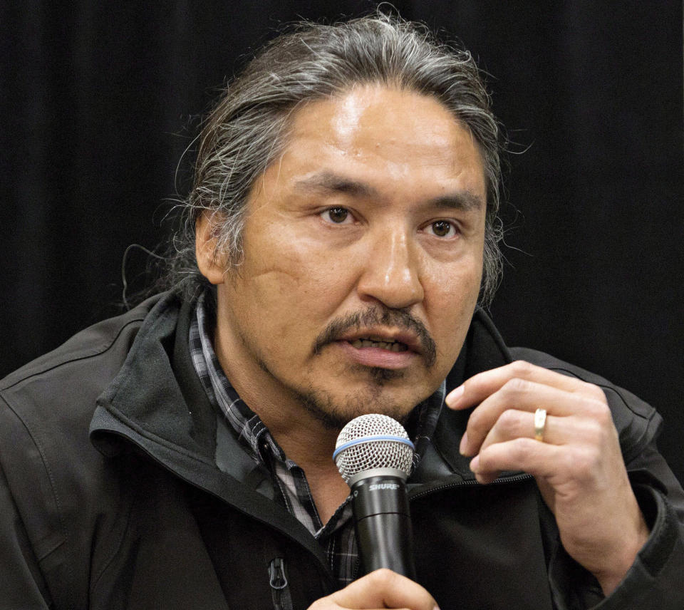 FILE - In this May 30, 2014 file photo, Chief Allan Adam of the Athabasca Chipewyan First Nation speaks during a news conference in Fort McMurray, Alberta, Canada. Canadian Prime Minister Justin Trudeau says police dashcam video of the violent arrest of Adam is shocking and not an isolated incident. The arrest has received attention in Canada as a backlash against racism grows in the wake of the death of George Floyd, a black man who died after a white Minneapolis police officer pressed a knee to his neck. (Jason Franson/The Canadian Press via AP)