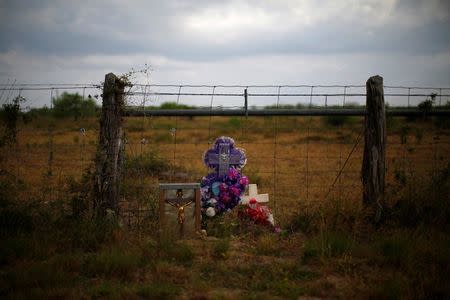 FILE PHOTO: A memorial is seen in the desert near Falfurrias, Texas April 2, 2013. REUTERS/Eric Thayer/File Photo