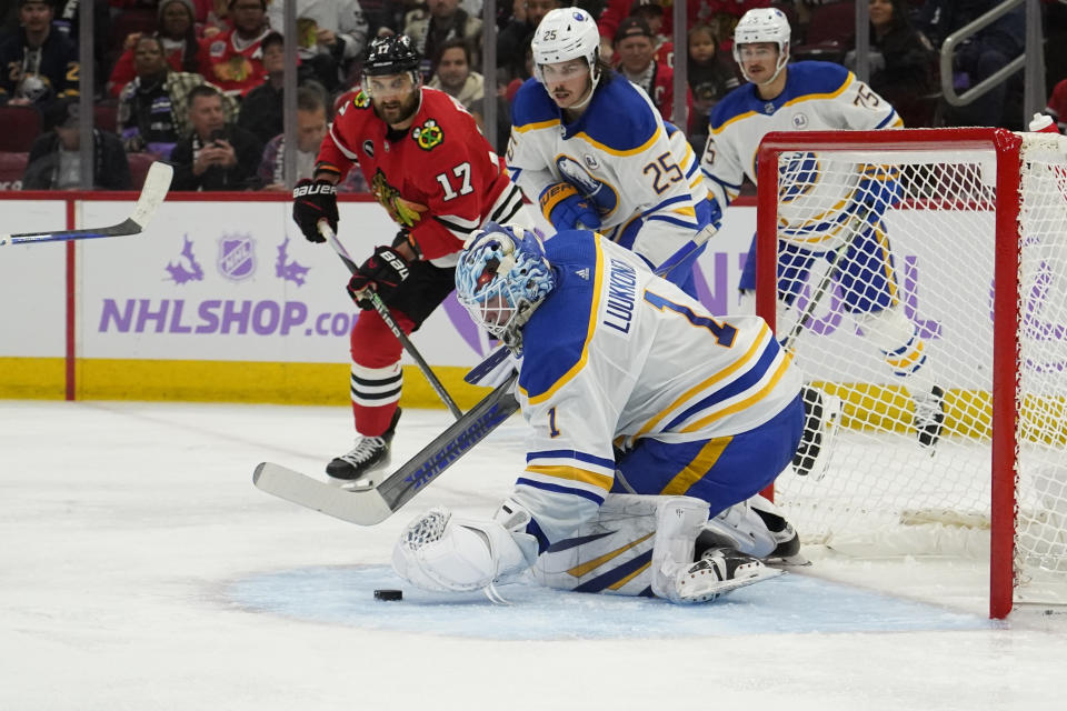 Buffalo Sabres goaltender Ukko-Pekka Luukkonen (1) makes a save on Chicago Blackhawks left wing Nick Foligno (17) during the second period of an NHL hockey game Sunday, Nov. 19, 2023, in Chicago. (AP Photo/David Banks)