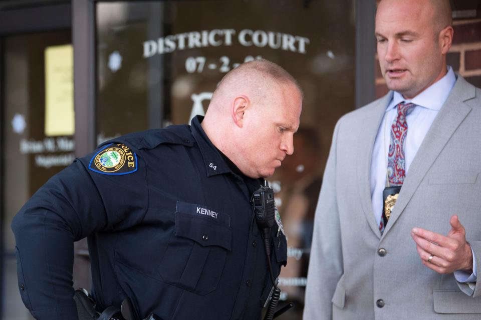 Northampton Patrolman James Kenney III (left) and Detective Richard Gensler (right) leave the courthouse after a preliminary hearing for Thadius McGrath.