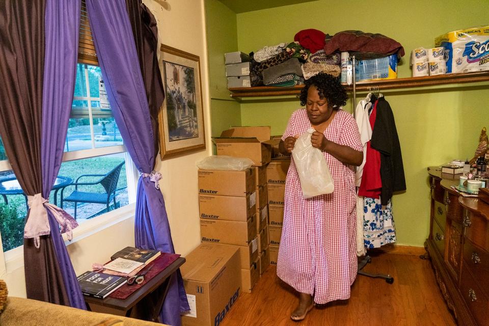 Sandra Stephenson uses a dialysis machine to treat her kidney failure in her home. A lot of leftovers from when she ran a day care in her home remain inside the house.