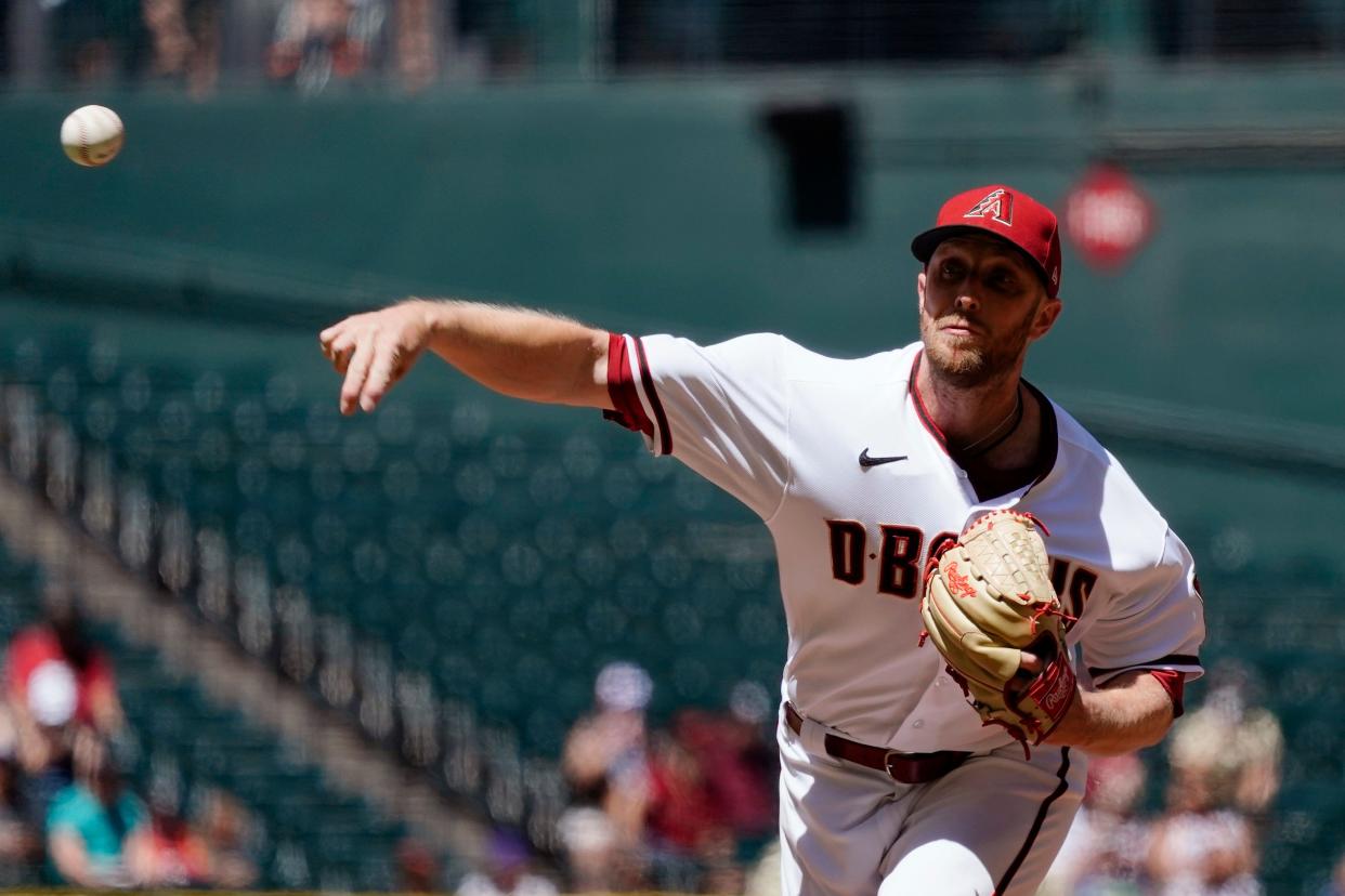 Arizona Diamondbacks starting pitcher Merrill Kelly throws against the Houston Astros during the first inning of a baseball game Wednesday, April 13, 2022, in Phoenix. (AP Photo/Ross D. Franklin)