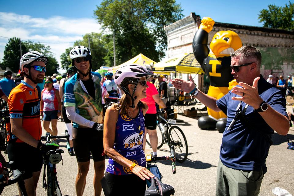 Ride Director Matt Phippen speaks with riders during the fifth day of RAGBRAI in 2022.