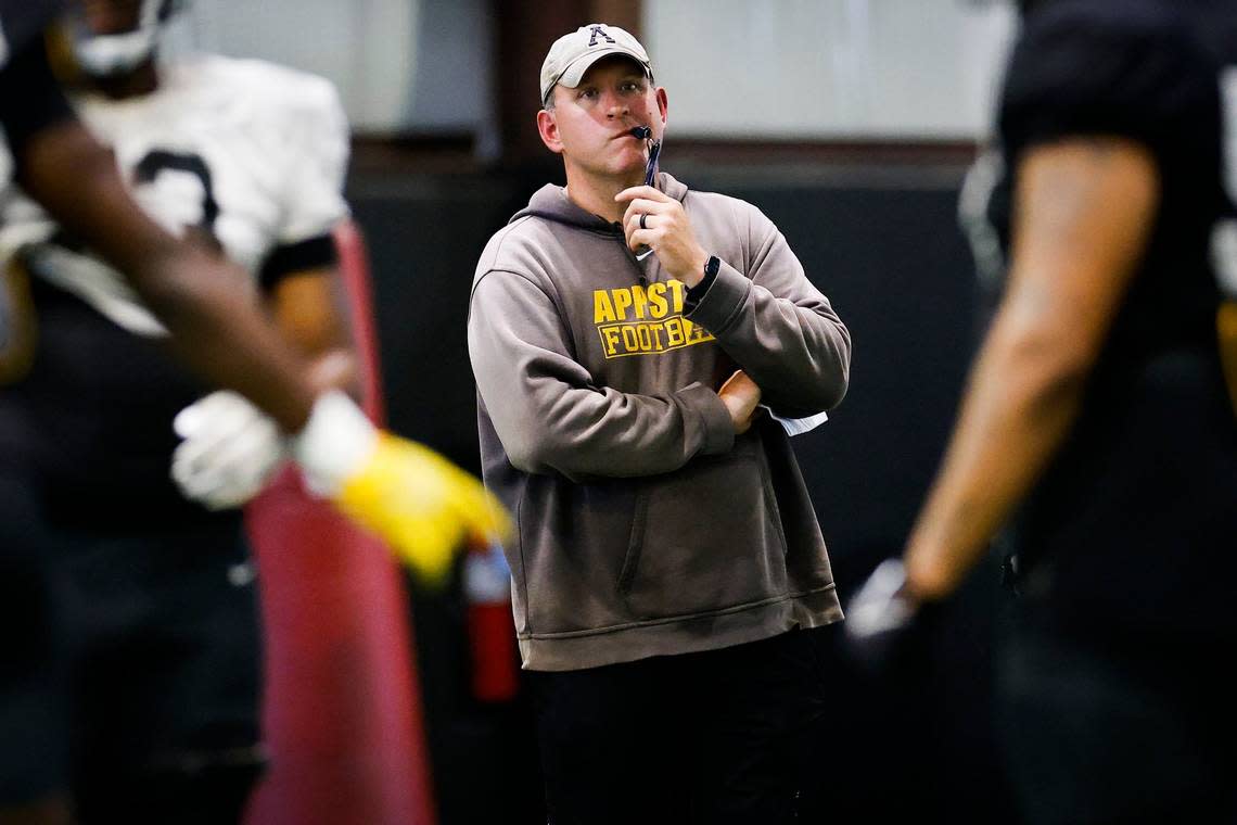 Appalachian State head football coach Shawn Clark watches from the sidelines during an indoor practice in Boone, N.C., Tuesday, Aug. 30, 2022. The Appalachian State Mountaineers football team is preparing to host UNC this weekend.