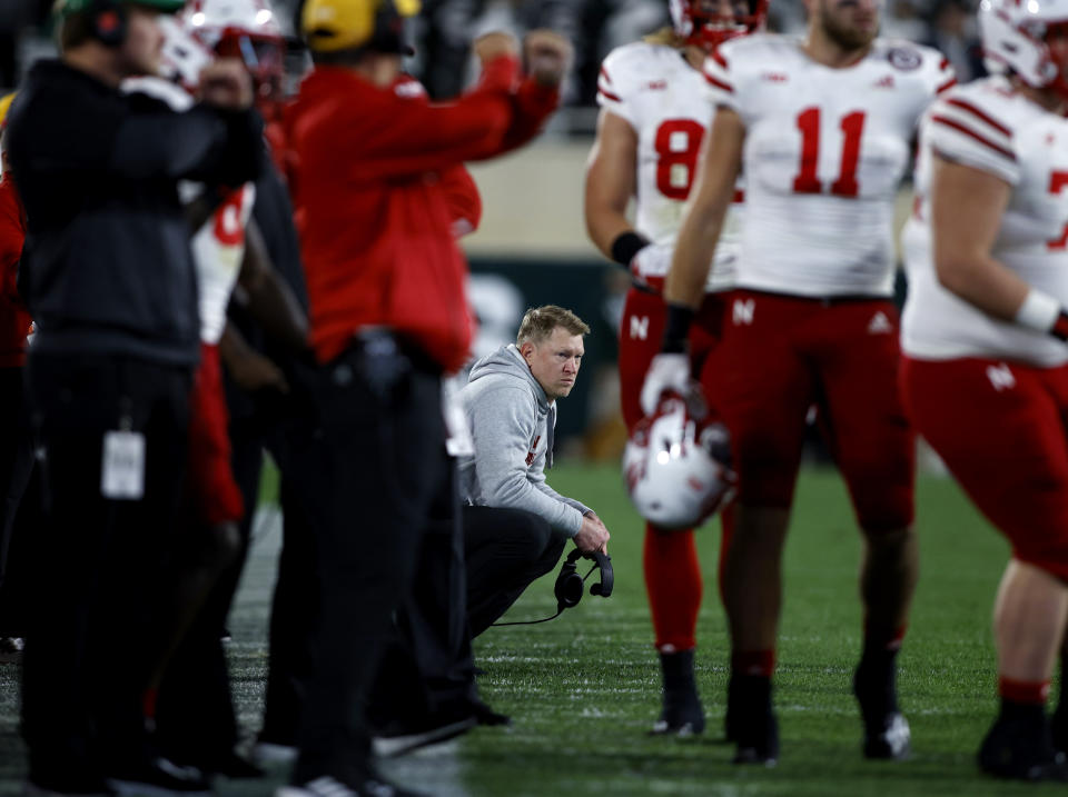 Nebraska coach Scott Frost, center, watches from the sideline against Michigan State during overtime of an NCAA college football game, Saturday, Sept. 25, 2021, in East Lansing, Mich. (AP Photo/Al Goldis)