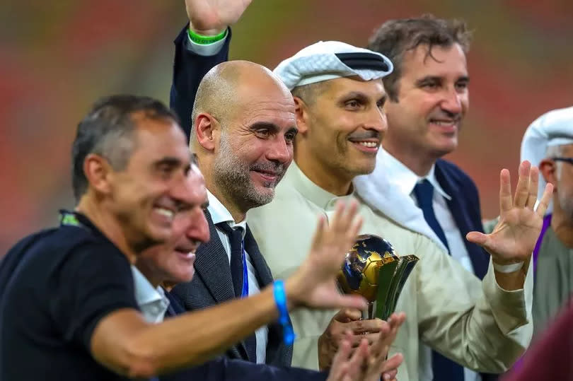 Pep Guardiola posed with Manel Estiarte, Txiki Begiristain, Khaldoon Al Mubarak and Ferran Soriano after leading Manchester City to the FIFA Club World Cup title.