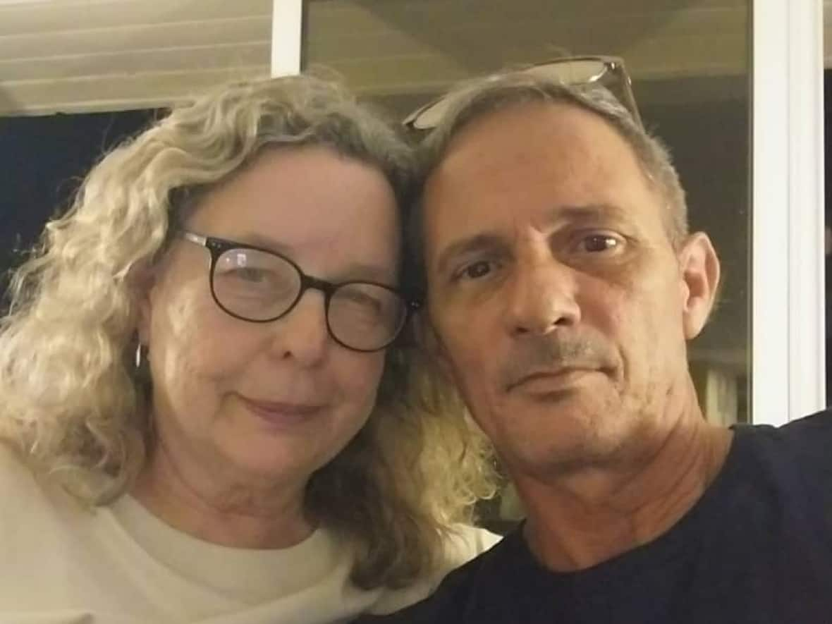 Mary Dahr, left, says by the time she put in a visitor visa application for her husband, Eugenio Camaraza, the wait had jumped to 209 days, and has since risen to more than a year, at 359 days.  (Submitted by Mary Dahr - image credit)