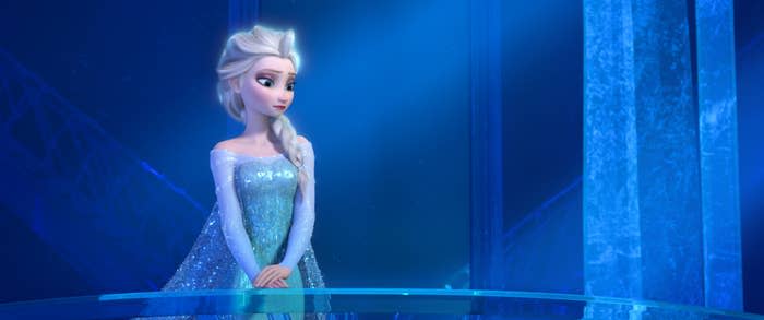 Elsa standing alone in her ice castle
