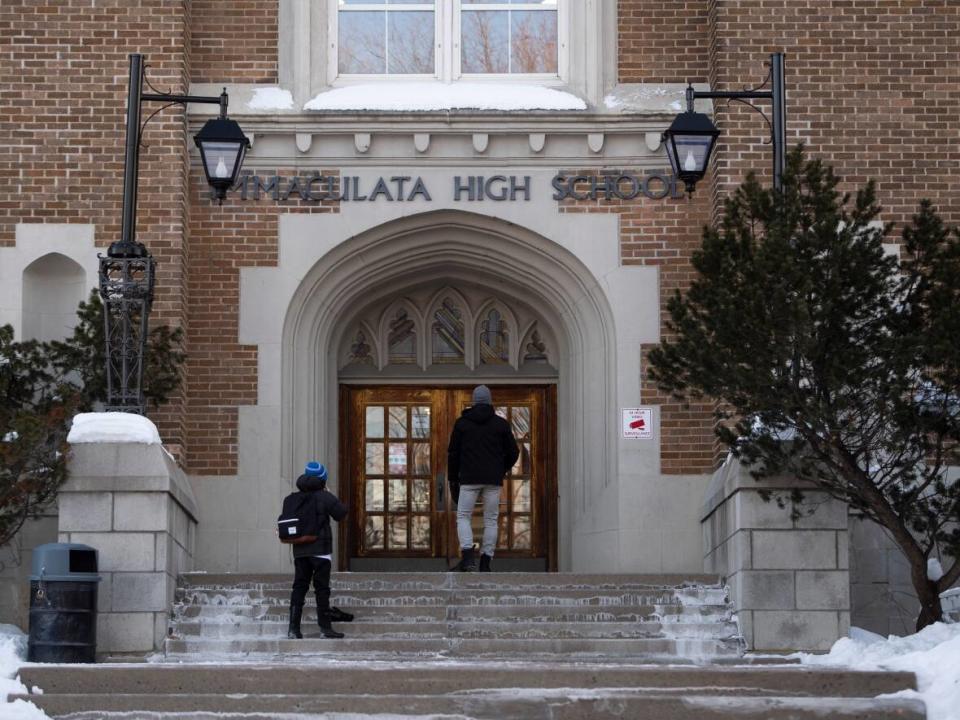A student gets dropped off outside Ottawa's Immaculata High School last February. In-person learning returns to Ontario's elementary and secondary schools Monday, but not all parents and students are pleased with the current plan. (Justin Tang/The Canadian Press - image credit)