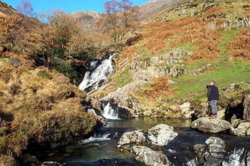 Afon Cwm Llan cascades down Snowdon near Watkin Path. Bathing in the pools by the path has become increasingly popular