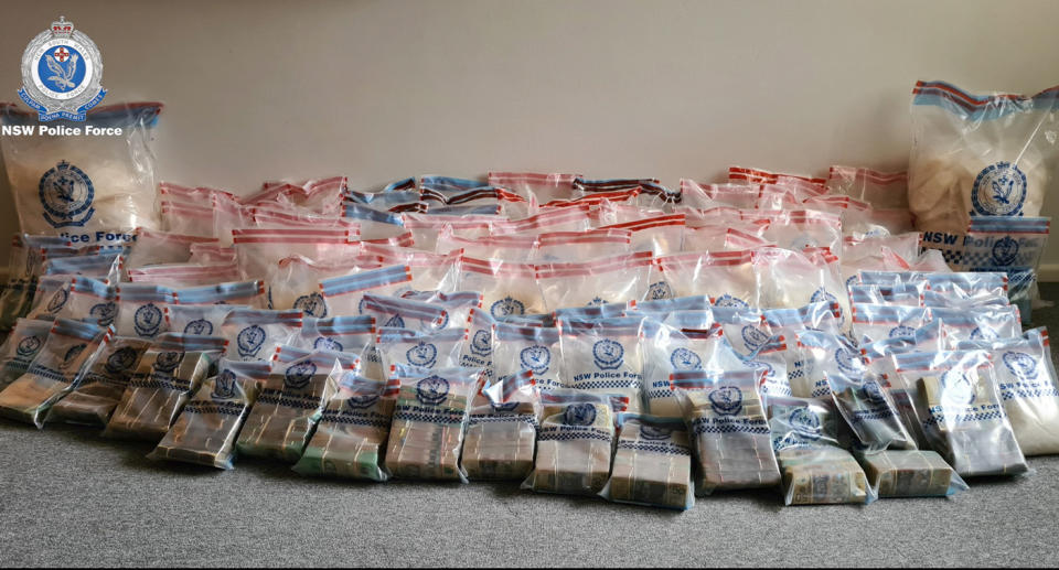 The crystal meth and cash in police evidence bags after the leaking toilet unit bust. 