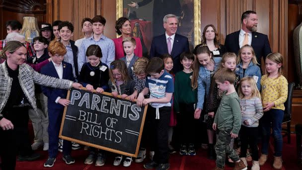 PHOTO: House Speaker Kevin McCarthy and Rep. Julia Letlow pose for a photo with children during an introduction of the 'Parents' Bill of Rights,' on Capitol Hill, March 1, 2023, in Washington. (Sarah Silbiger/Reuters)