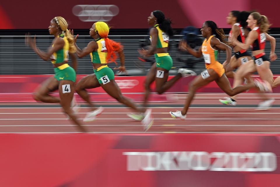 <p>TOPSHOT - Jamaica's Elaine Thompson-Herah (4), Jamaica's Shelly-Ann Fraser-Pryce (5) and amaica's Shericka Jackson (7) compete in the women's 100m final during the Tokyo 2020 Olympic Games at the Olympic Stadium in Tokyo on July 31, 2021. (Photo by Andrej ISAKOVIC / AFP) (Photo by ANDREJ ISAKOVIC/AFP via Getty Images)</p> 