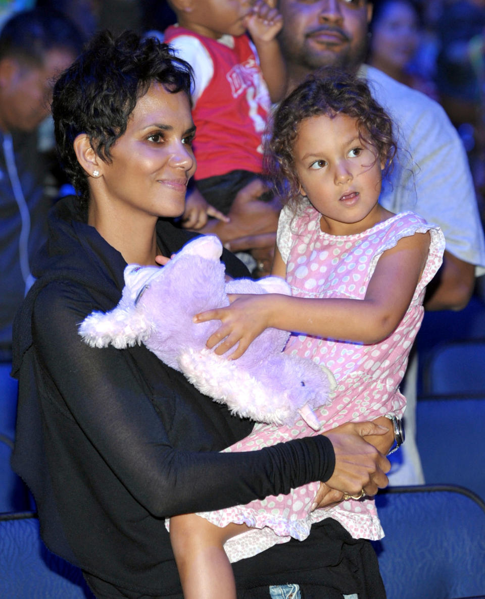 Halle Berry, left, and daughter Nahla Aubry attend attend Yo Gabba Gabba! Live!: Get The Sillies Out! 50+ city tour kick-off performance on Thanksgiving weekend at Nokia Theatre L.A. Live on Friday Nov. 23, 2012 in Los Angeles. (Photo by John Shearer/Invision for GabbaCaDabra, LLC./AP Images)