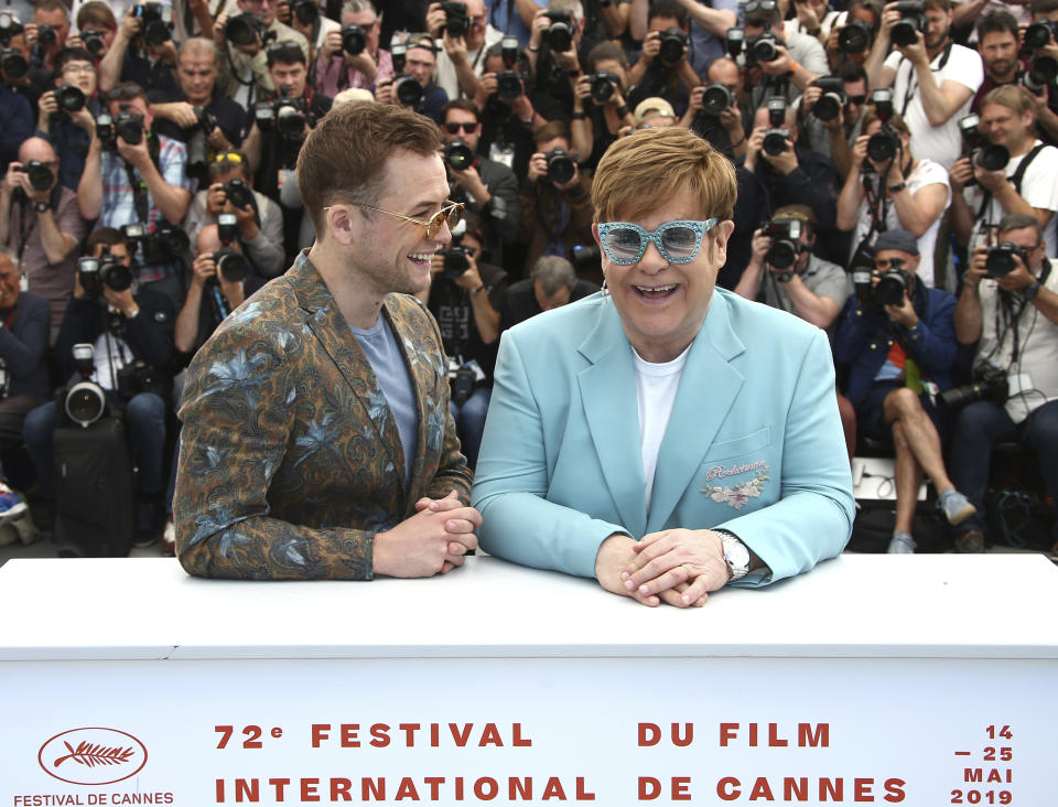 Actor Taron Egerton, left, and singer Elton John pose for photographers at the photo call for the film 'Rocketman' at the 72nd international film festival, Cannes, southern France, Thursday, May 16, 2019. (Photo by Joel C Ryan/Invision/AP)