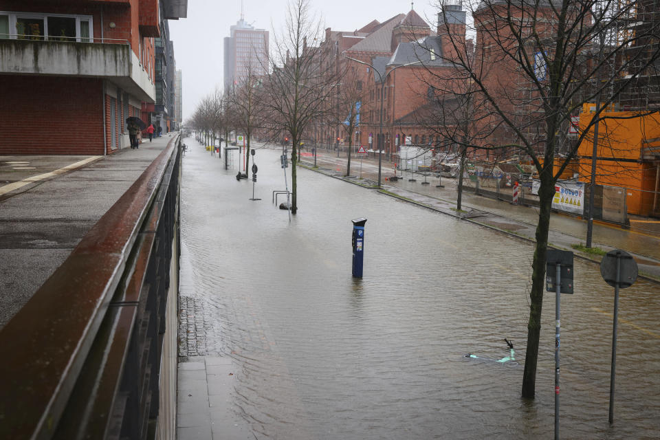 A flooded street in Hafencity, Hamburg, Germany, Friday Dec. 22, 2023. There is a risk of a severe storm surge for the German North Sea coast and Hamburg on Friday. (Christian Charisius/dpa via AP)