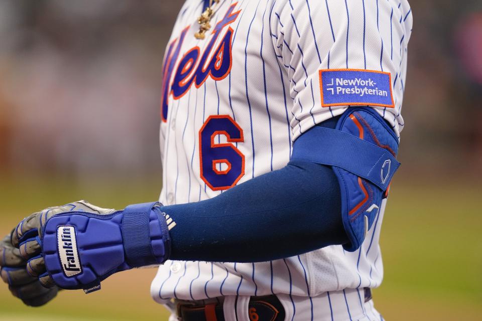 New York Mets' Starling Marte (6) returns to the dugout after grounding out during the first inning of a baseball game against the Washington Nationals Tuesday, April 25, 2023, in New York. On the uniform is a sponsor patch. (AP Photo/Frank Franklin II)