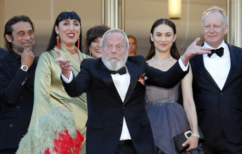 71st Cannes Film Festival - Closing ceremony and screening of the film "The Man Who Killed Don Quixote" out of competition - Red Carpet Arrivals - Cannes, France, May 19, 2018 - Director Terry Gilliam gestures as cast members Jordi Molla, Rossy De Palma, Olga Kurylenko and Stellan Skarsgard look on. REUTERS/Jean-Paul Pelissier