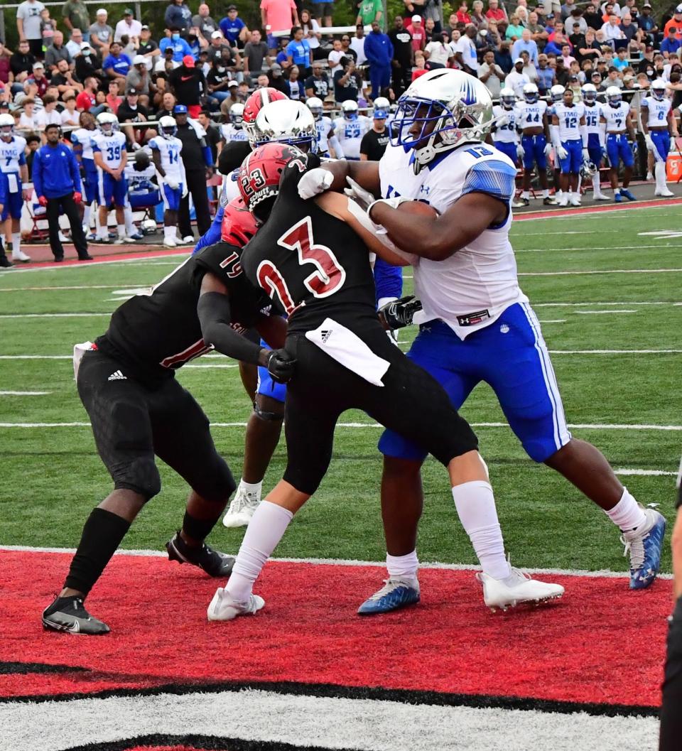 IMG Academy's Kaytron Allen (13) forces his way through the La Salle defense for a touchdown, Sept. 3, 2021.