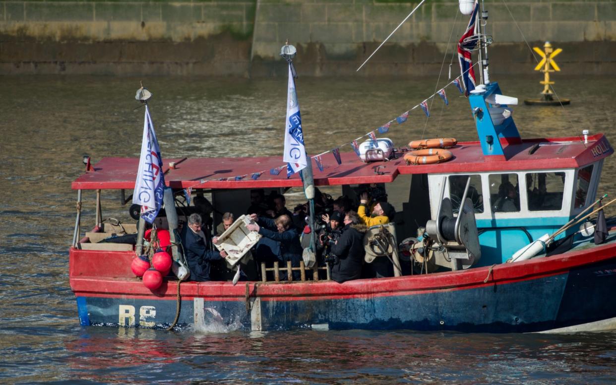 Former Ukip party leader Nigel Farage and Fishing for Leave supporters throw fish overboard into the River Thames - Getty Images Europe