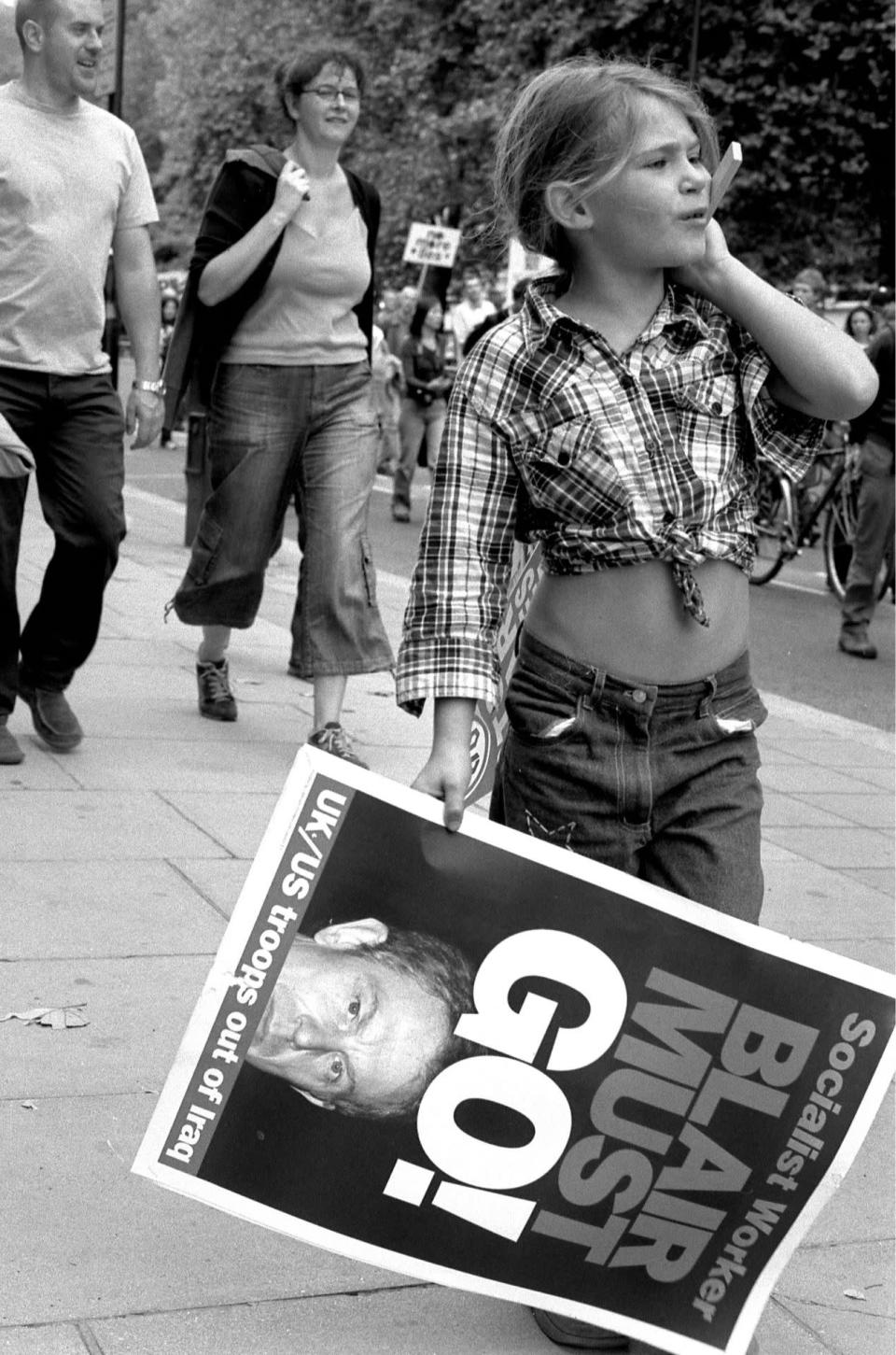 A young girl marches alongside fellow protesters in Hyde Park, London