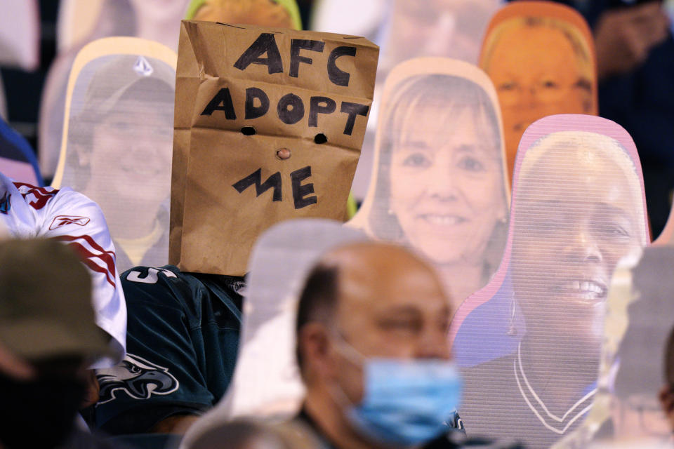 A Philadelphia Eagles' fan wears a paper bag during the second half of an NFL football game against the New York Giants, Thursday, Oct. 22, 2020, in Philadelphia. (AP Photo/Chris Szagola)