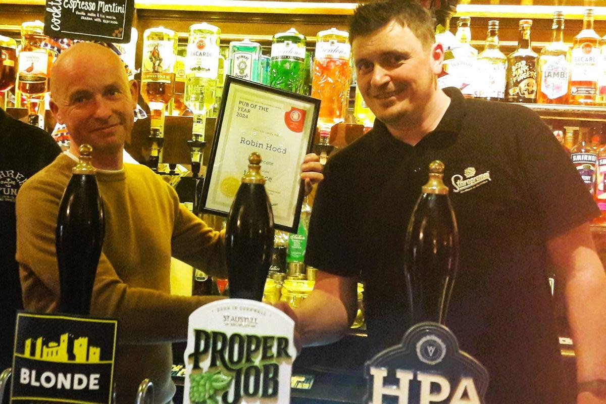 Stourbridge and Halesowen Branch of CAMRA chairman Tim Cadwell handing over the Pub of the Year award to Ben Jeavons <i>(Image: Stourbridge and Halesowen Branch of CAMRA)</i>