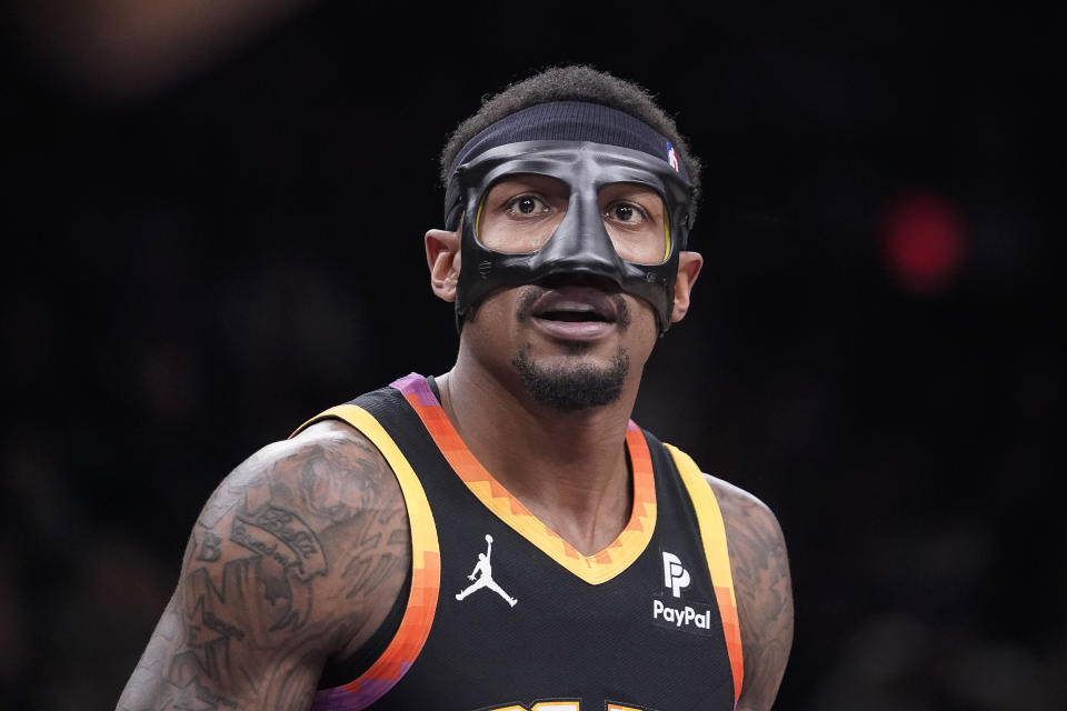 Phoenix Suns' Bradley Beal (3) wears a face protector for his broken nose during the first half of an NBA basketball game against the Utah Jazz in Phoenix, Thursday, Jan. 8, 2024. (AP Photo/Darryl Webb)