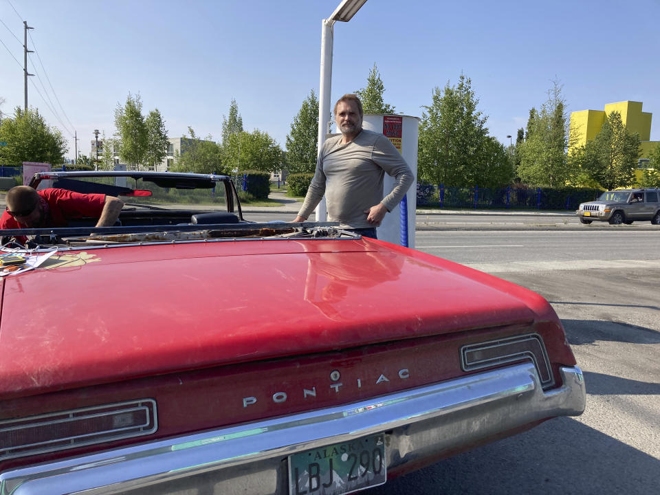 James Grim takes a break from detailing his 1968 Pontiac Catalina convertible at a car wash in Anchorage, Alaska Wednesday, July 1, 2020. Grim said he was upset lawmakers have their hands in the fund and reduced the amount of money that's available for the yearly oil wealth check that is sent to nearly every resident. (AP Photo/Mark Thiessen)