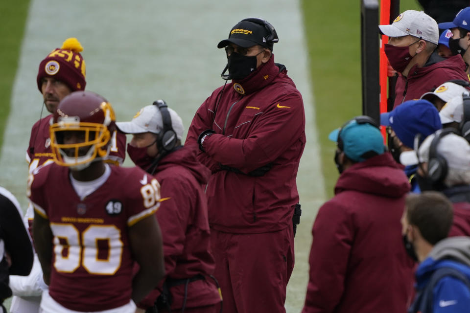 Washington Football Team head coach Ron Rivera, center, on the sidelines during the first half of an NFL football game against Dallas Cowboys, Sunday, Oct. 25, 2020, in Landover, Md. (AP Photo/Susan Walsh)