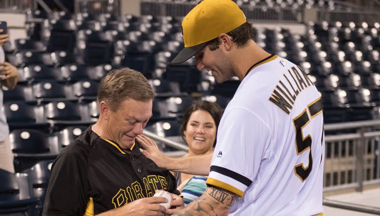 PITTSBURGH, PA - SEPTEMBER 07: Trevor Williams #57 of the Pittsburgh Pirates gives his father Richard Williams the game ball after getting his first Major League win as the Pittsburgh Pirates defeated the St. Louis Cardinals 4-3at PNC Park on September 7, 2016 in Pittsburgh, Pennsylvania. (Photo by Justin Berl/Getty Images)