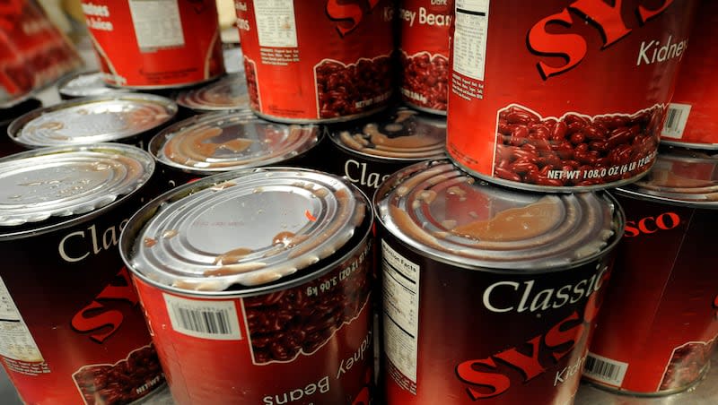 Cans of kidney beans are opened and stacked, ready to be emptied into a large vat, to make chili for the midshipmen's evening meal at the at the United States Naval Academy in Annapolis, Md., Tuesday, Nov. 18, 2008.