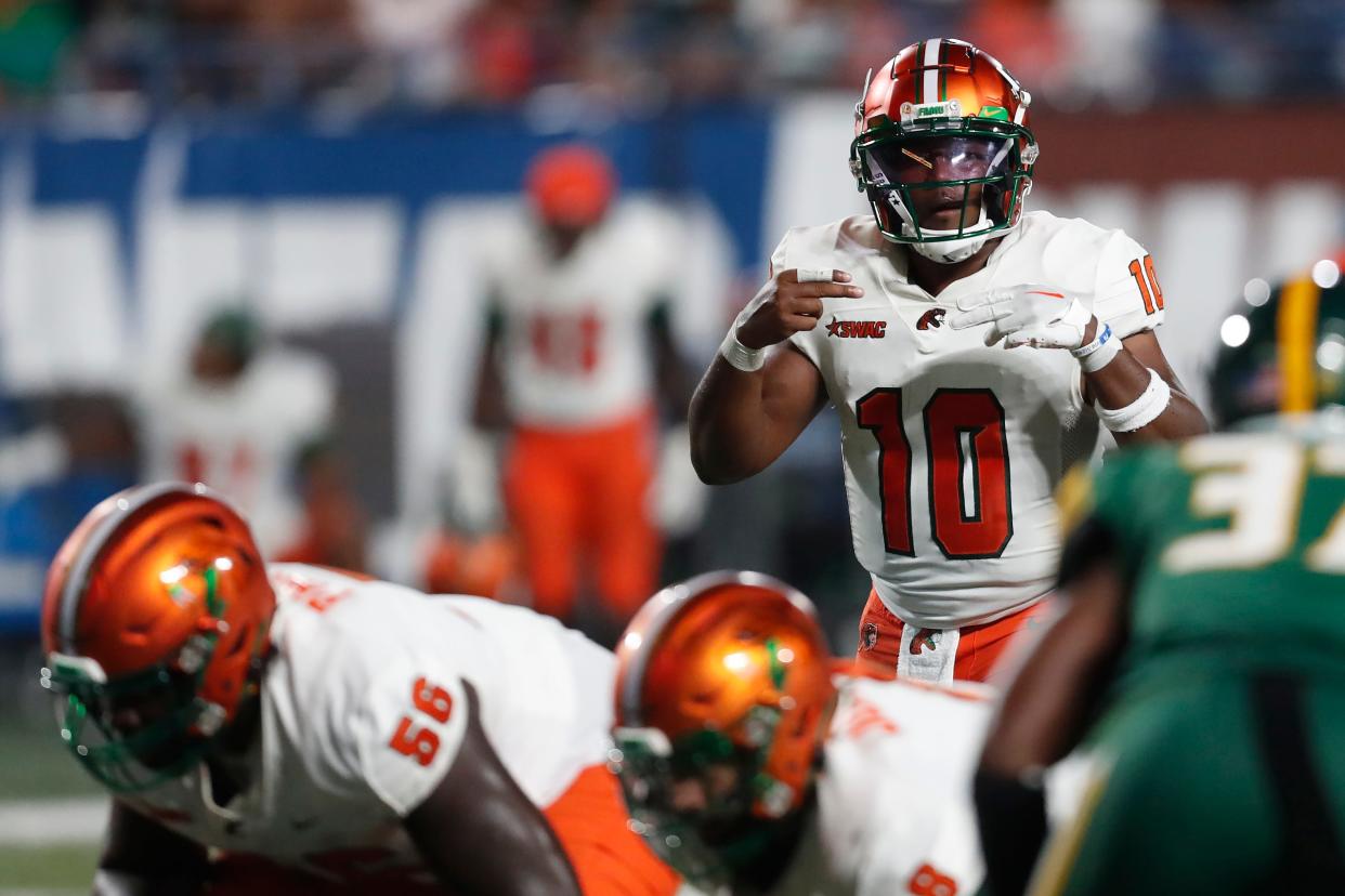 Florida A&M quarterback Daniel Richardson (10) gets ready to run a play during the Cricket MEAC-SWAC Challenge NCAA college football game against Norfolk State in Atlanta on Saturday, Aug. 24, 2024.