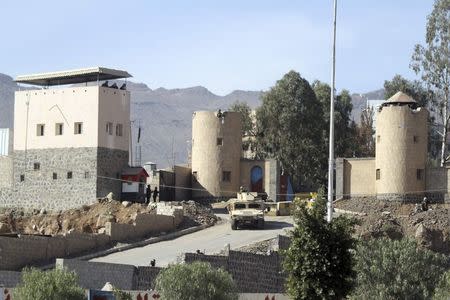 A vehicle from the Presidential Protection Forces is seen positioned outside the house of President Hadi during clashes near the house and the Presidential Palace in Sanaa January 19, 2015. REUTERS/Mohamed al-Sayaghi