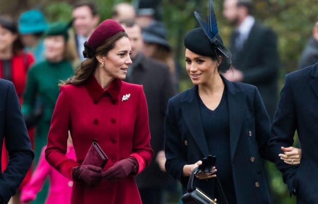 <p>Kate Middleton walked alongside <strong><a href="https://parade.com/tag/meghan-markle" rel="nofollow noopener" target="_blank" data-ylk="slk:Meghan Markle;elm:context_link;itc:0;sec:content-canvas" class="link ">Meghan Markle</a></strong> as she attended her first Christmas service as a member of the royal family.</p><p>Kate was festive in a crimson coat by her favorite designer Catherine Walker, accessorized with a cute matching hat and gold hoop earrings.</p><p>Meghan, who revealed in her and <strong><a href="https://parade.com/tag/prince-harry" rel="nofollow noopener" target="_blank" data-ylk="slk:Prince Harry;elm:context_link;itc:0;sec:content-canvas" class="link ">Prince Harry</a></strong>'s <a href="https://parade.com/1015716/samuelmurrian/best-movies-on-netflix/" rel="nofollow noopener" target="_blank" data-ylk="slk:Netflix;elm:context_link;itc:0;sec:content-canvas" class="link ">Netflix</a> series that she wore muted colors to blend in when she was a royal, sports a navy <strong><a href="https://parade.com/tag/victoria-beckham" rel="nofollow noopener" target="_blank" data-ylk="slk:Victoria Beckham;elm:context_link;itc:0;sec:content-canvas" class="link ">Victoria Beckham</a> </strong>dress and matching coat.</p>