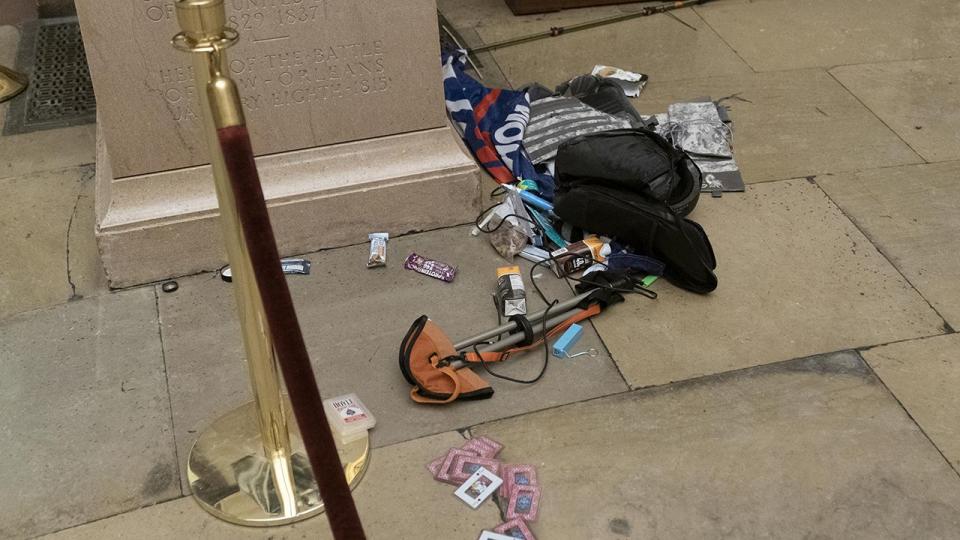 Debris and personal belongings are strewn across the floor of the Rotunda in the early morning hours after protesters stormed the Capitol on Wednesday in Washington, Thursday, Jan. 7, 2021.